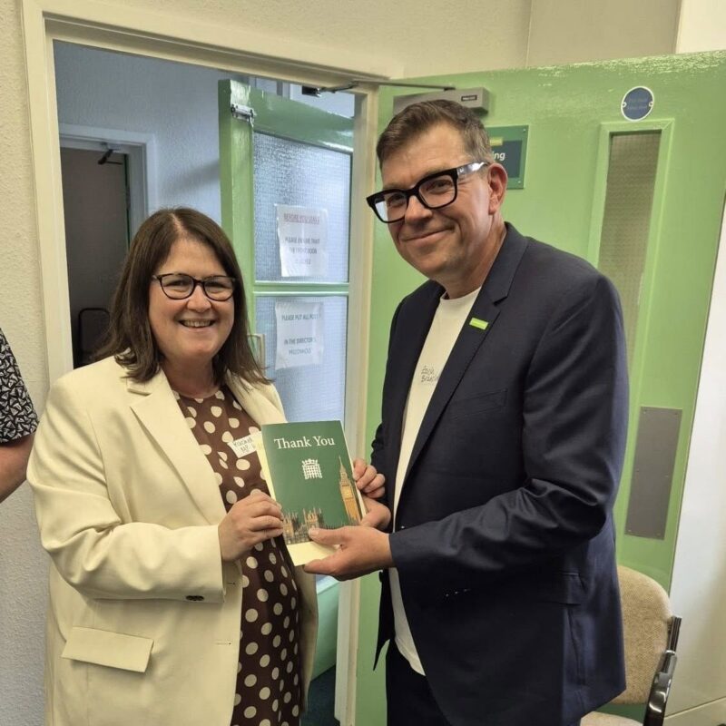 Rachel Hopkins MP presenting Zac from Luton, South Bedfordshire & Harpenden Samaritans with a Community Thank You card
